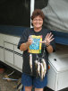 dee holding five fish